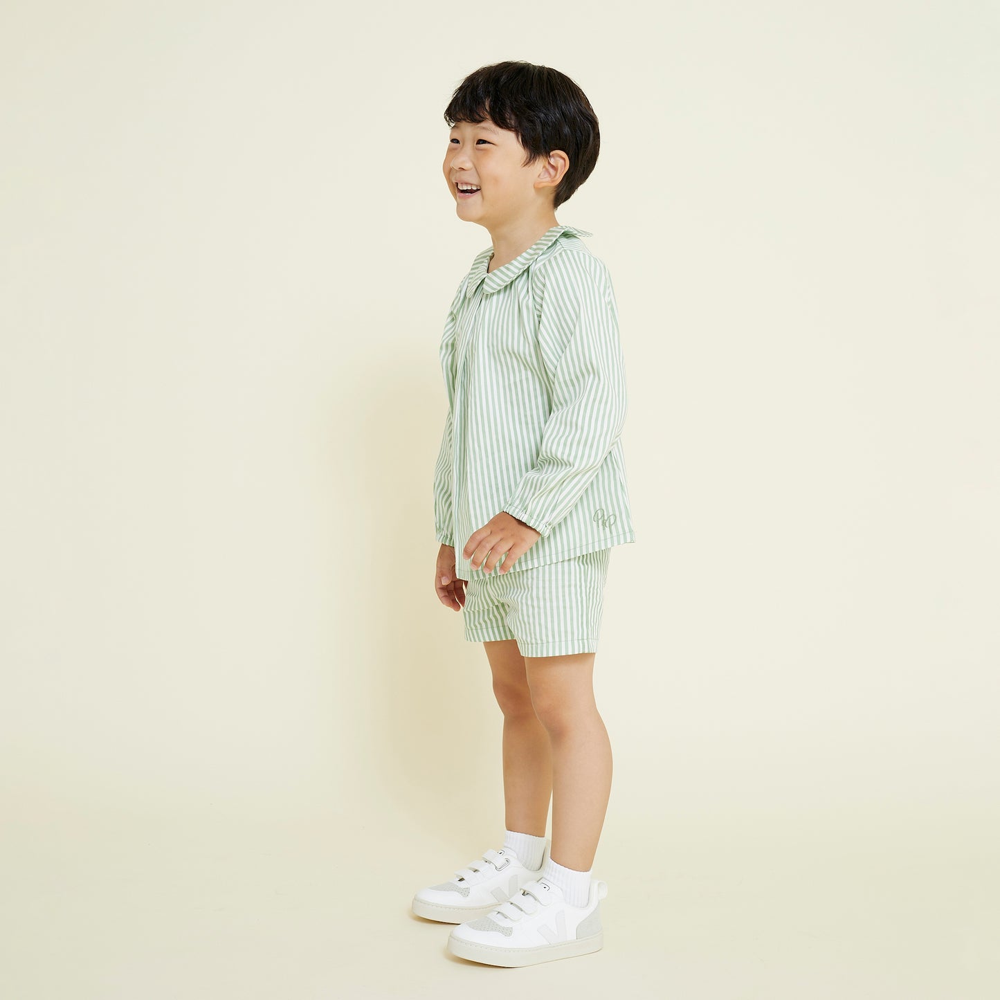 5 year old boy wears Collared Shirt and Casual Short pull on style in sage green and white stripes
