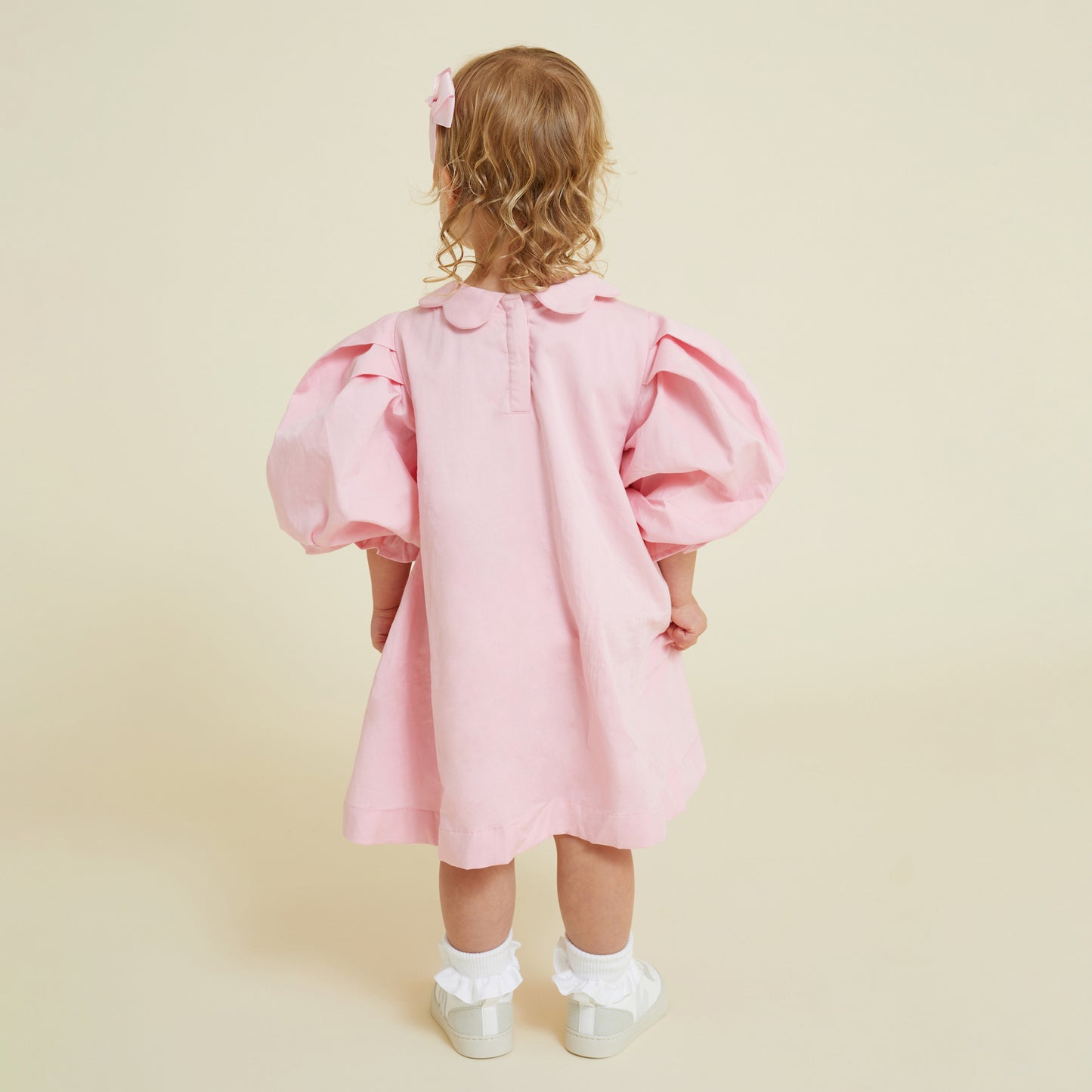 Back of almond pink scallop collar smock dress with puff sleeve