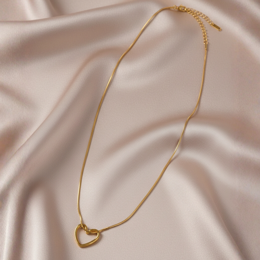 A full length detailed image of 18k gold fine gold love heart pendant
