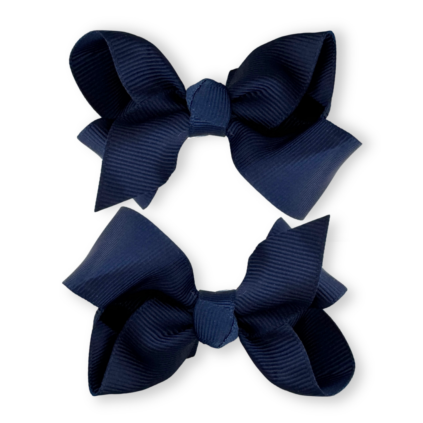 Two navy blue hair bows on a white background
