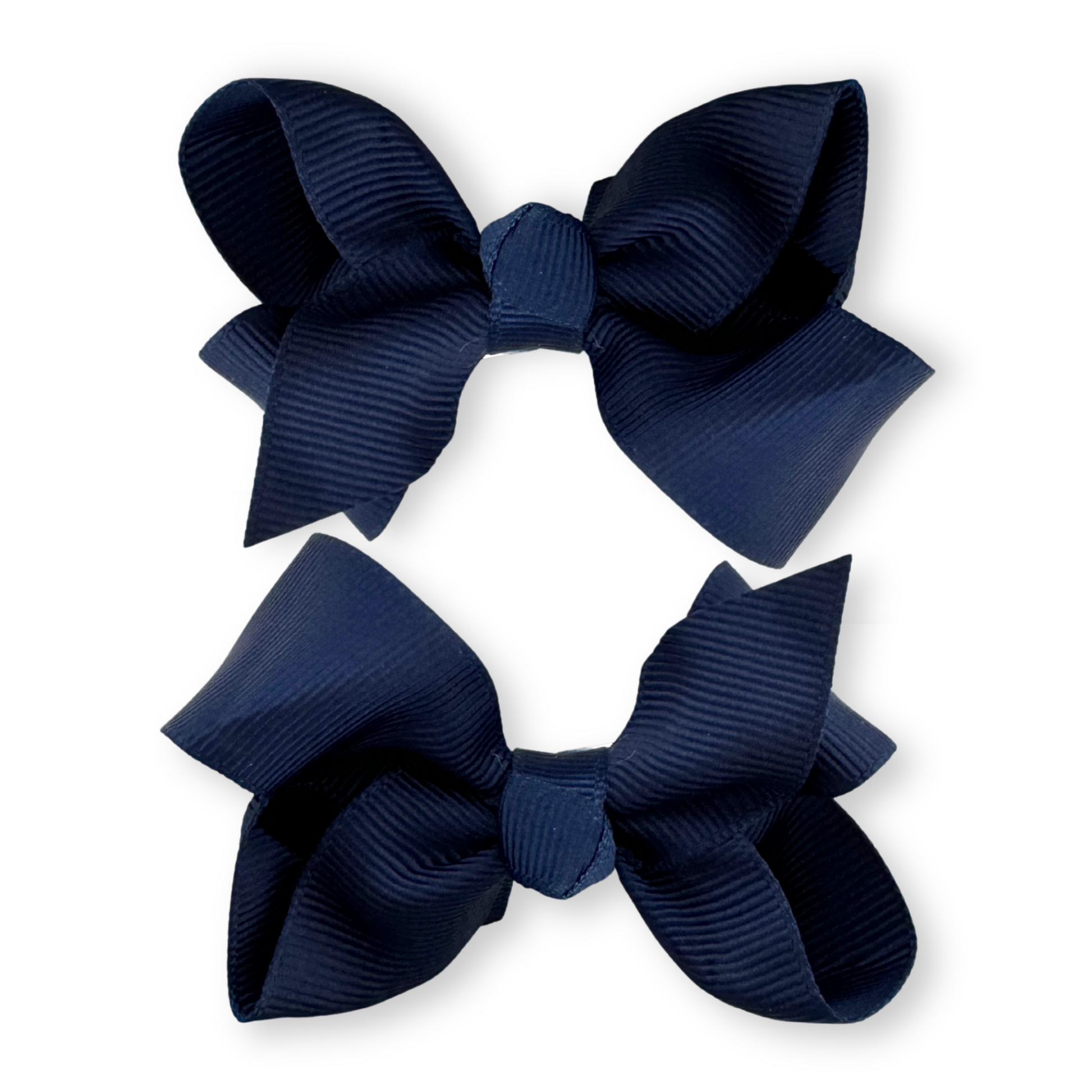 Two navy blue hair bows on a white background