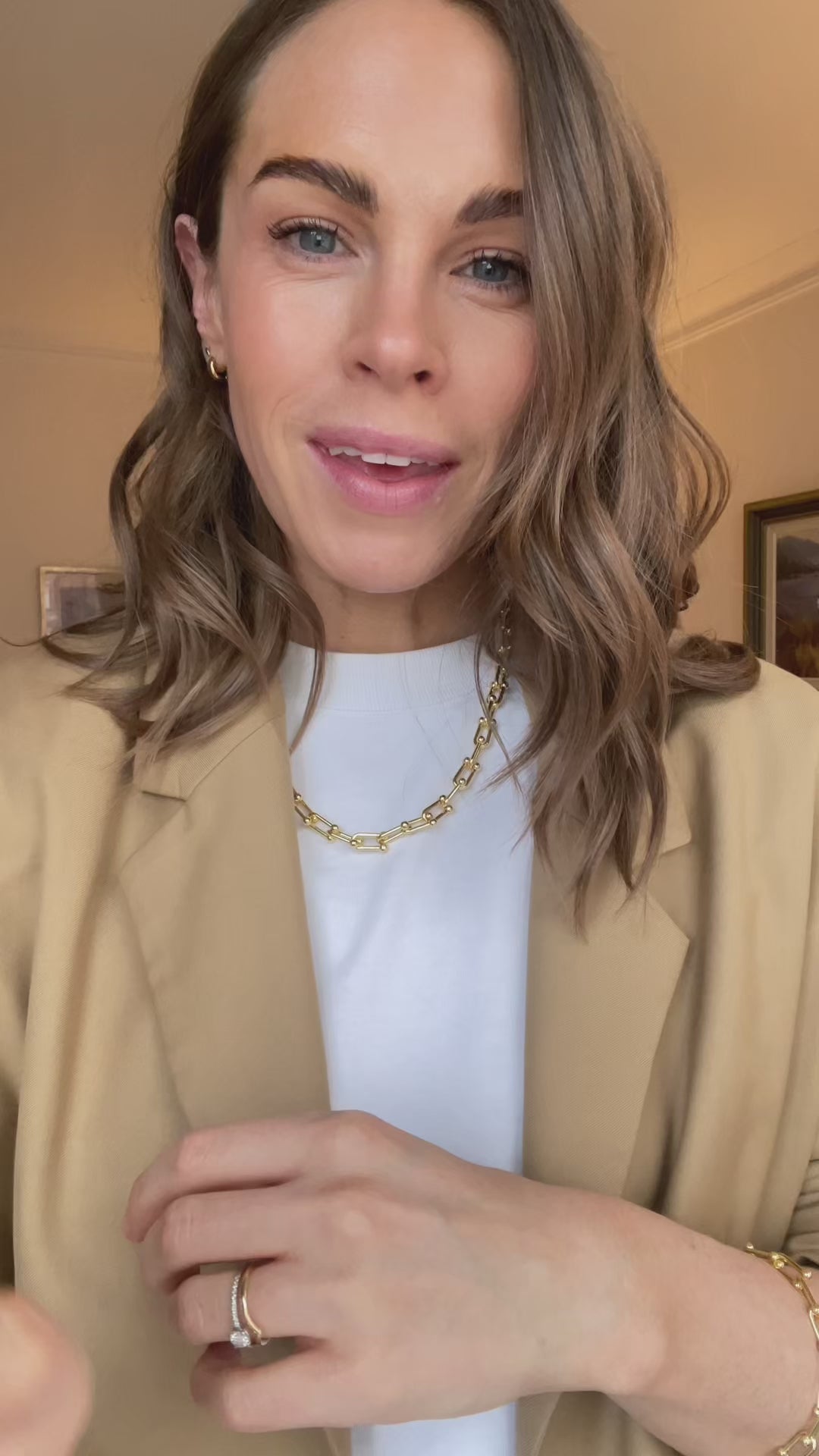 Kate describes how you can shorten the gold chain link necklace by removing some of the links
